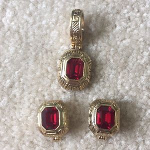 Goldtone and red earrings and pendant set.